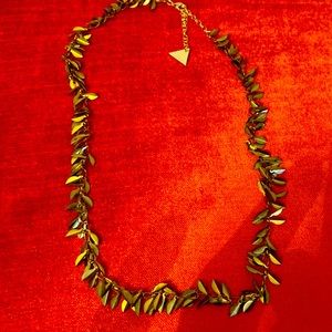 Gold tone necklace. Adjustable size with toggle closure.